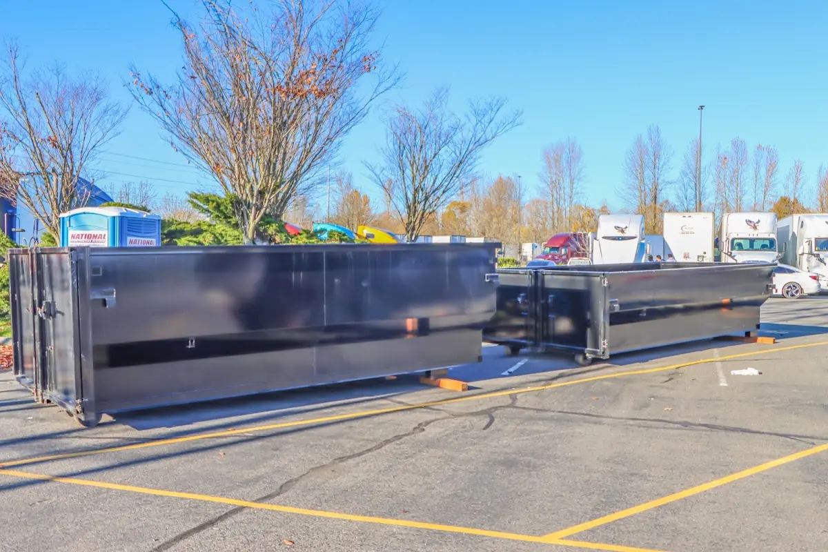 Professional dumpster rental service with roll-off container on residential driveway in Bellflower